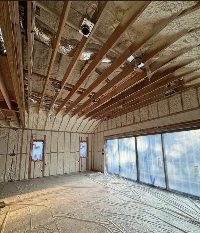 Interior walls and ceiling insulated with spray foam during new construction in Badger